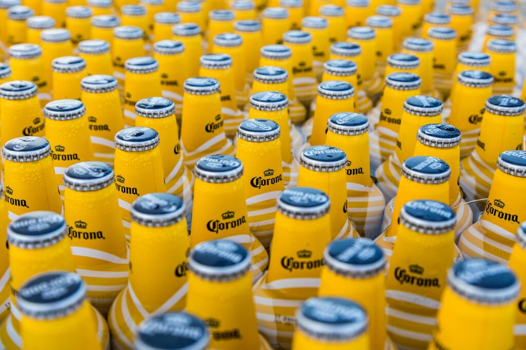 A close-up view of chilled Corona beer bottles displaying repetition and cool refreshment.